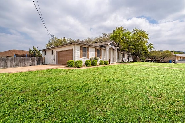 7900 Bar K Ranch Rd, Lago Vista, TX 78645 - ranch-style home featuring a front lawn, driveway, an attached garage, and fence
