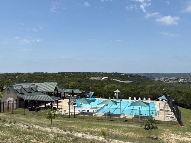 7900 Bar K Ranch Rd, Lago Vista, TX 78645 - community pool featuring a water slide and fence