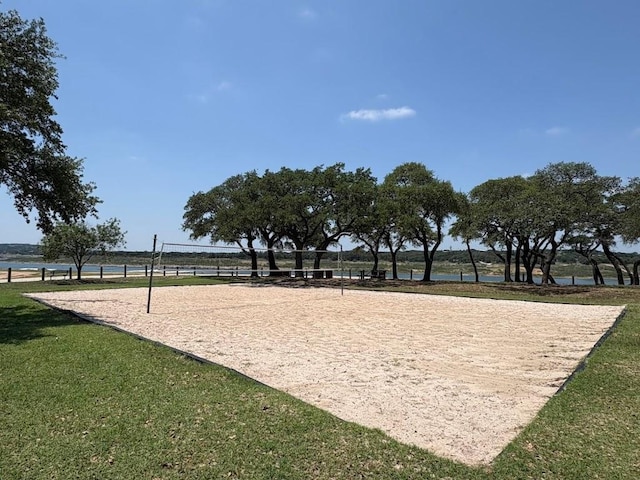7900 Bar K Ranch Rd, Lago Vista, TX 78645 - surrounding community with volleyball court and a yard