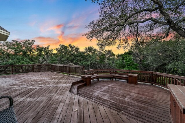 8001 Bell Mountain Dr, Austin, TX 78730 - deck at dusk with view of scattered trees