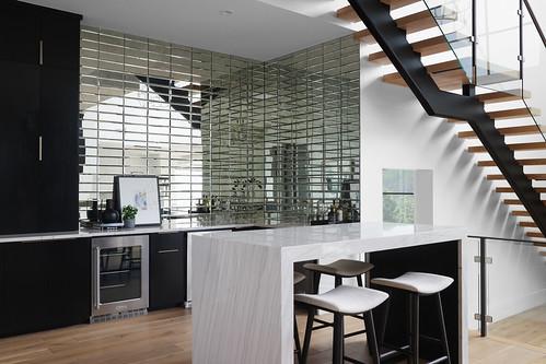 2701 Toro Canyon Rd Unit B, Austin, TX 78746 - indoor bar with beverage cooler, stairs, and wood finished floors