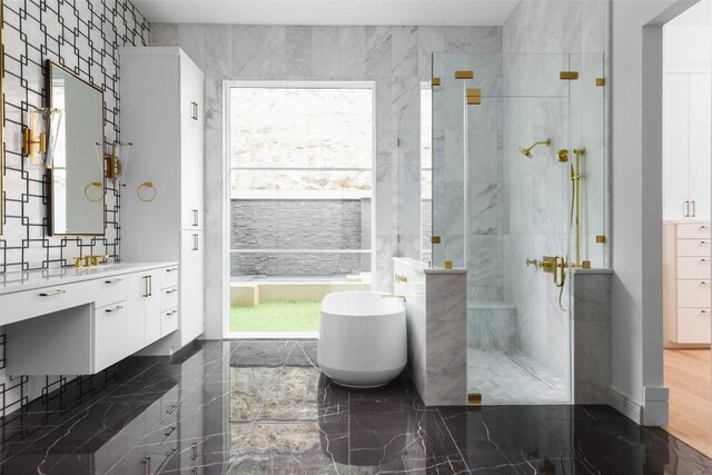 2701 Toro Canyon Rd Unit B, Austin, TX 78746 - bathroom with a stall shower, a freestanding bath, marble tiled floors, and vanity