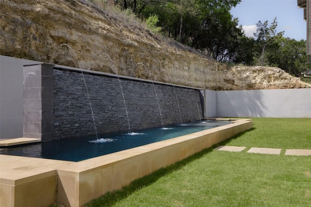 2701 Toro Canyon Rd Unit B, Austin, TX 78746 - view of swimming pool featuring a lawn