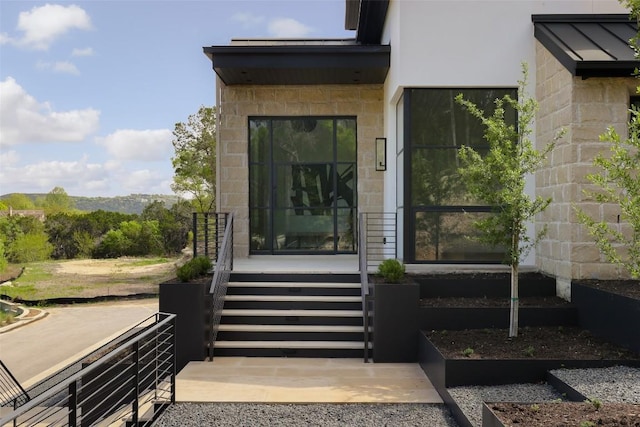 2701 Toro Canyon Rd Unit B, Austin, TX 78746 - doorway to property featuring stone siding