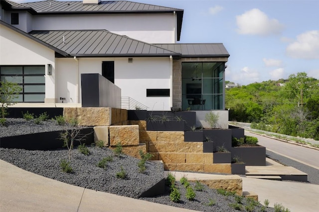 2701 Toro Canyon Rd Unit B, Austin, TX 78746 - doorway to property with a standing seam roof, metal roof, and stucco siding