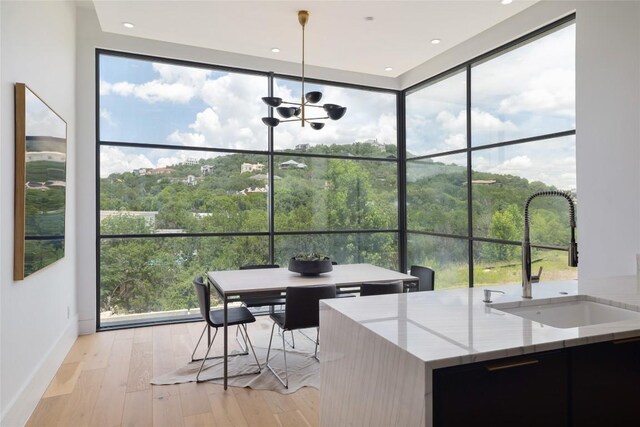 2701 Toro Canyon Rd Unit B, Austin, TX 78746 - sunroom / solarium featuring plenty of natural light and a chandelier