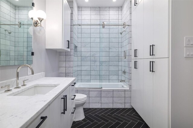 2701 Toro Canyon Rd Unit B, Austin, TX 78746 - bathroom featuring tiled shower / bath, vanity, tile patterned floors, and recessed lighting