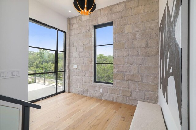 2701 Toro Canyon Rd Unit B, Austin, TX 78746 - spare room with wood-type flooring and healthy amount of natural light