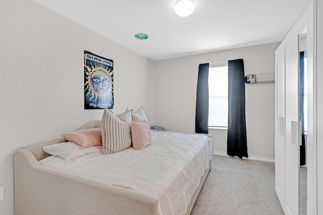 197 Eves Necklace Dr, Buda, TX 78610 - bedroom featuring light carpet and baseboards