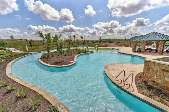 197 Eves Necklace Dr, Buda, TX 78610 - pool with a patio area, a gazebo, and fence