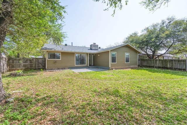 2009 Scofield Ln, Austin, TX 78727 - rear view of property with a patio area and a chimney