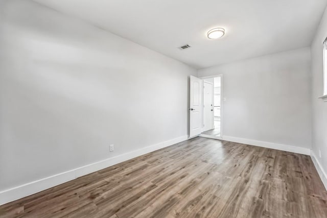 2009 Scofield Ln, Austin, TX 78727 - spare room with baseboards and wood finished floors