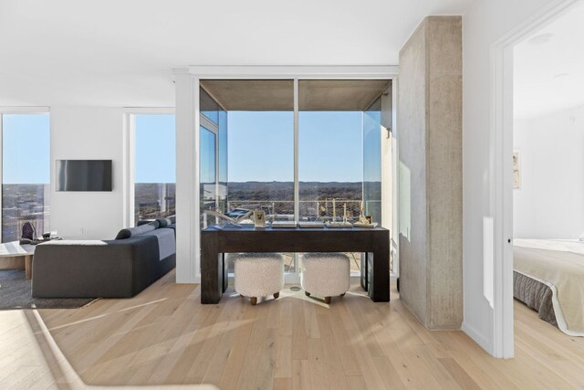 313 W 17th St Unit 1605, Austin, TX 78701 - living area with wood finished floors and floor to ceiling windows