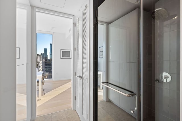 313 W 17th St Unit 1605, Austin, TX 78701 - hallway with light tile patterned floors and a city view