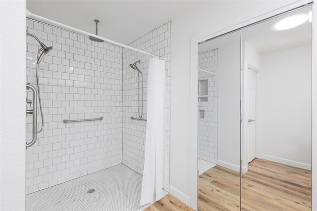 12300 Cassady Dr, Austin, TX 78727 - bathroom featuring wood finished floors and a shower stall