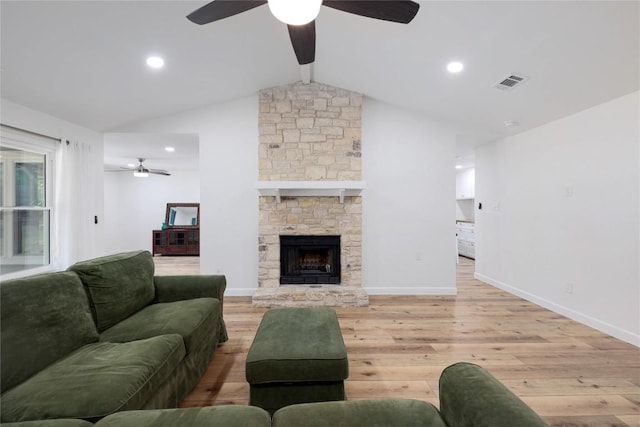 12300 Cassady Dr, Austin, TX 78727 - living area with a ceiling fan, light wood-type flooring, and a stone fireplace