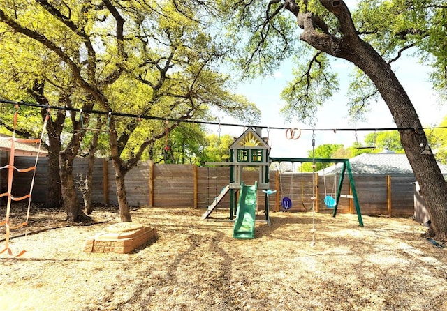 12300 Cassady Dr, Austin, TX 78727 - view of jungle gym with a fenced backyard