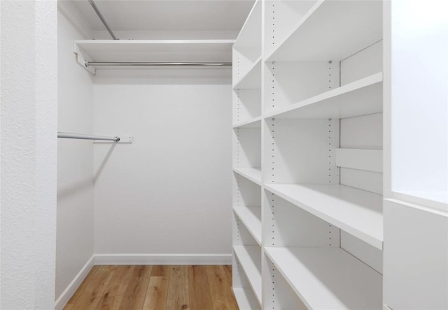 12300 Cassady Dr, Austin, TX 78727 - walk in closet featuring light wood-type flooring