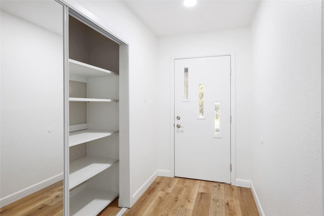 12300 Cassady Dr, Austin, TX 78727 - doorway featuring wood finished floors and baseboards