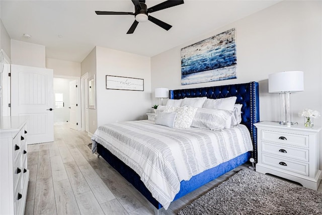 96 Island Dr Unit 44, Horseshoe Bay, TX 78657 - bedroom with light wood finished floors and a ceiling fan
