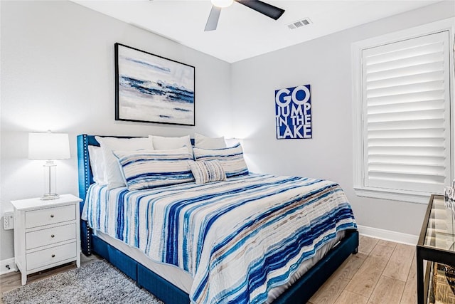 96 Island Dr Unit 44, Horseshoe Bay, TX 78657 - bedroom with wood finished floors and a ceiling fan