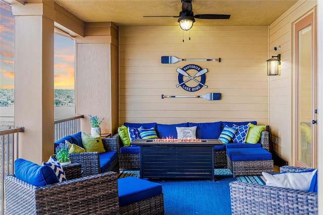 96 Island Dr Unit 44, Horseshoe Bay, TX 78657 - balcony featuring an outdoor living space with a fire pit and a ceiling fan