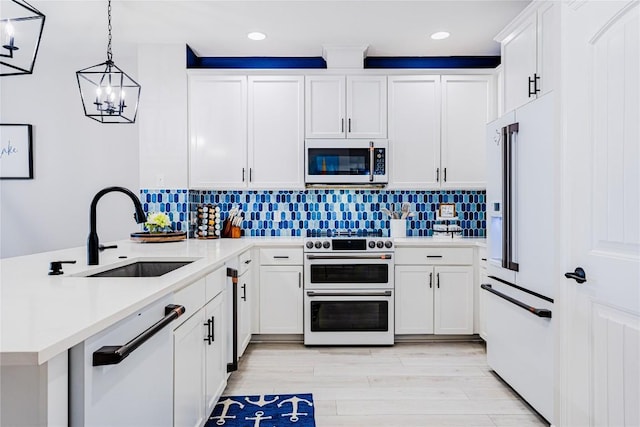 96 Island Dr Unit 44, Horseshoe Bay, TX 78657 - kitchen with high quality appliances, a peninsula, recessed lighting, light countertops, and decorative backsplash