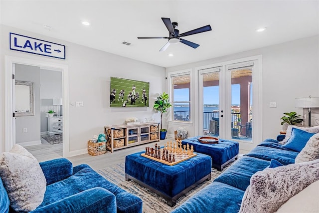 96 Island Dr Unit 44, Horseshoe Bay, TX 78657 - living area with ceiling fan, recessed lighting, wood finished floors, and french doors