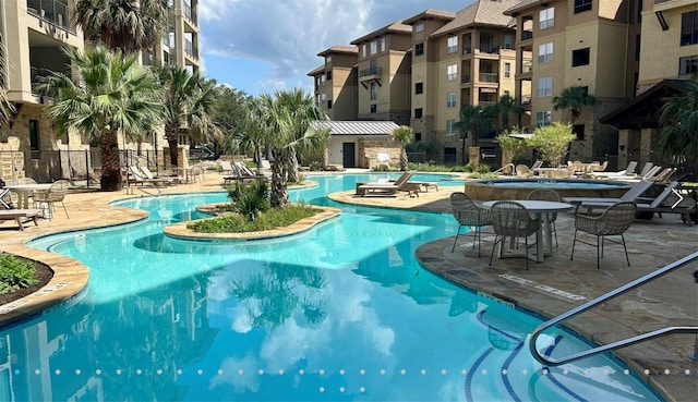 96 Island Dr Unit 44, Horseshoe Bay, TX 78657 - community pool featuring a patio and a community hot tub