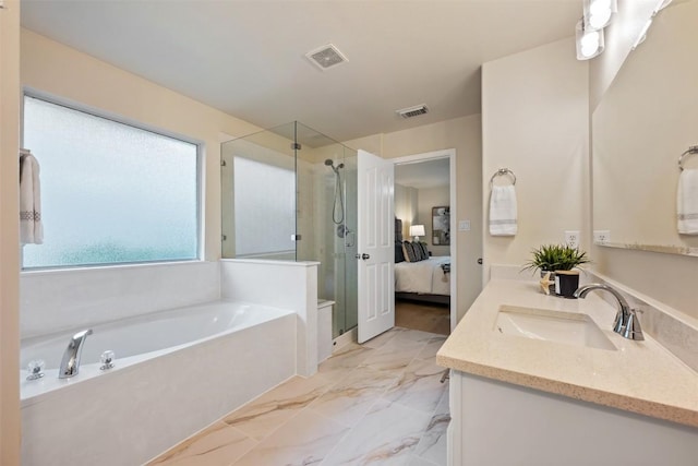 3615 Turkey Path Bnd, Cedar Park, TX 78613 - ensuite bathroom with a shower stall, vanity, a garden tub, and marble finish floors