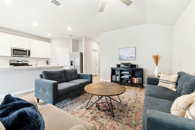 806 Vineyard Falls Rd, Austin, TX 78748 - living area with light wood finished floors, ceiling fan, baseboards, and recessed lighting