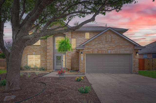 706 Belmont Dr, Georgetown, TX 78626 - traditional-style house featuring brick siding, concrete driveway, a garage, and fence