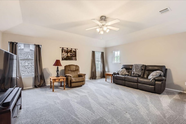 706 Belmont Dr, Georgetown, TX 78626 - living area featuring a tray ceiling, visible vents, ceiling fan, and carpet flooring