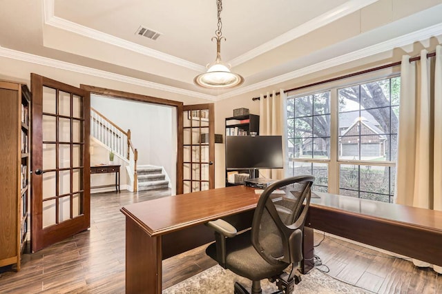 706 Belmont Dr, Georgetown, TX 78626 - home office with visible vents, crown molding, wood finished floors, a raised ceiling, and french doors