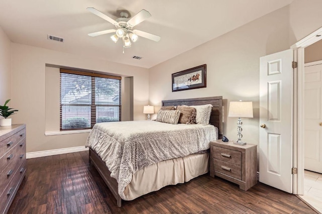 706 Belmont Dr, Georgetown, TX 78626 - bedroom with dark wood-style floors, visible vents, baseboards, and a ceiling fan