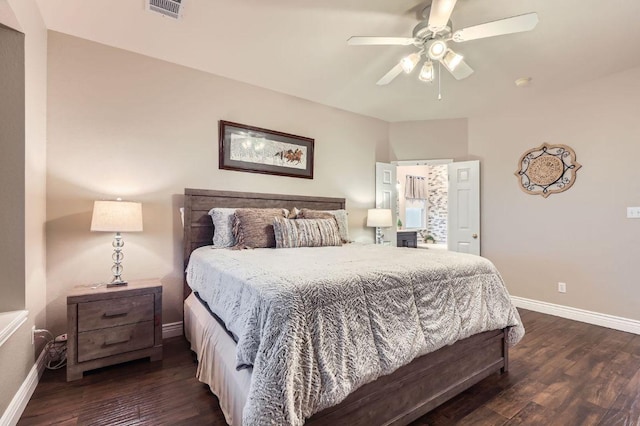 706 Belmont Dr, Georgetown, TX 78626 - bedroom featuring a ceiling fan, dark wood-style flooring, baseboards, and visible vents