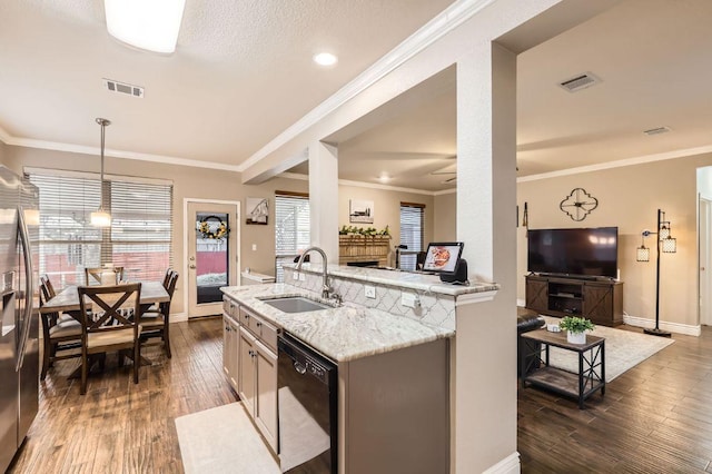 706 Belmont Dr, Georgetown, TX 78626 - kitchen with dark wood-type flooring, a sink, visible vents, black dishwasher, and a fireplace