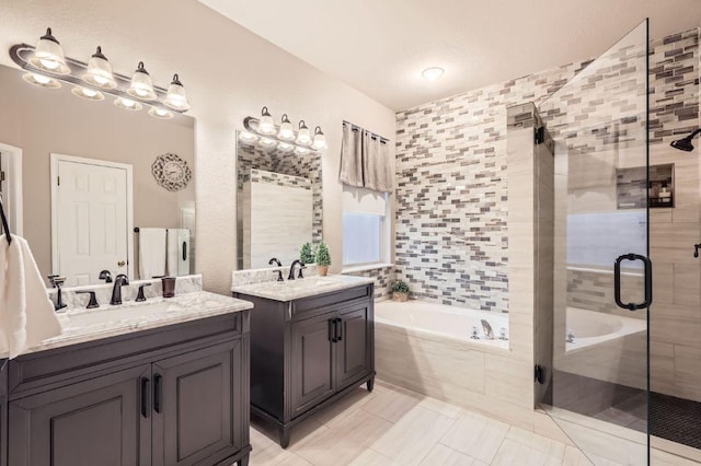 706 Belmont Dr, Georgetown, TX 78626 - full bathroom featuring a bath, a sink, a shower stall, and two vanities