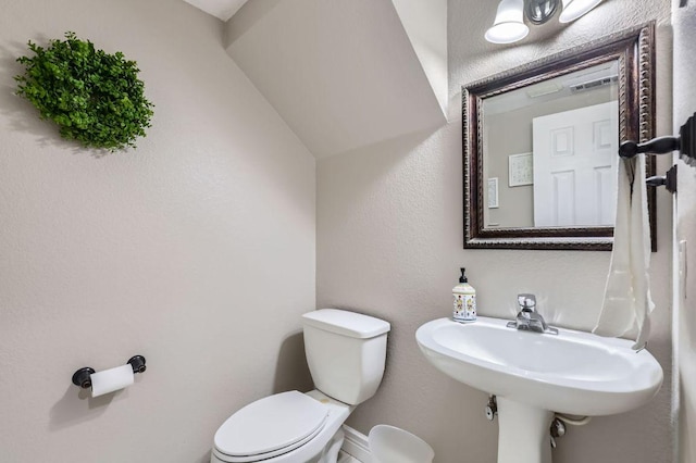 706 Belmont Dr, Georgetown, TX 78626 - half bath with baseboards, toilet, and a sink