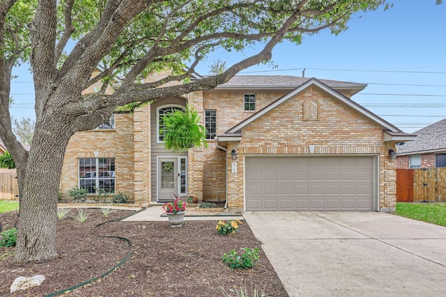706 Belmont Dr, Georgetown, TX 78626 - traditional-style house with brick siding, concrete driveway, fence, and an attached garage