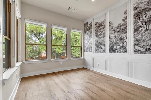 unfurnished sunroom with healthy amount of natural light
