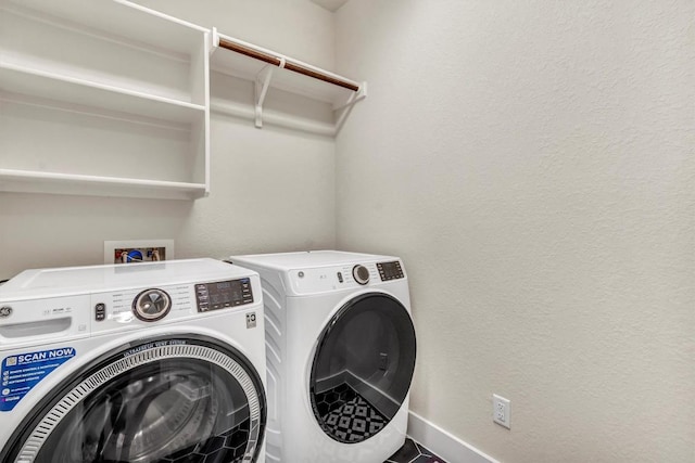 laundry area featuring independent washer and dryer and baseboards