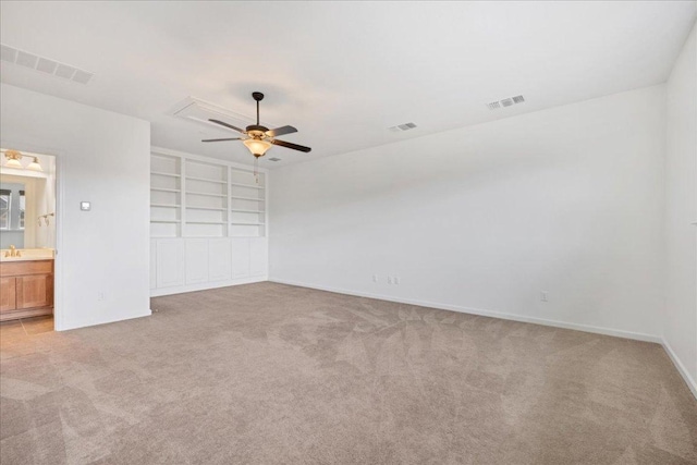 5701 Cherokee Draw Rd, Austin, TX 78738 - unfurnished bedroom with light colored carpet, attic access, baseboards, and connected bathroom