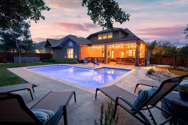 5701 Cherokee Draw Rd, Austin, TX 78738 - pool at dusk featuring a patio and a fenced backyard
