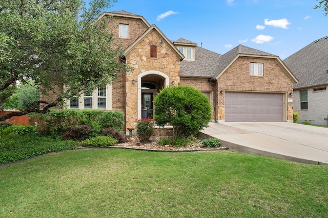 5701 Cherokee Draw Rd, Austin, TX 78738 - view of front of property with concrete driveway, a front lawn, brick siding, a garage, and a shingled roof