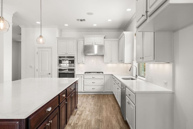 5701 Cherokee Draw Rd, Austin, TX 78738 - kitchen with a sink, under cabinet range hood, stainless steel appliances, white cabinetry, and ornamental molding