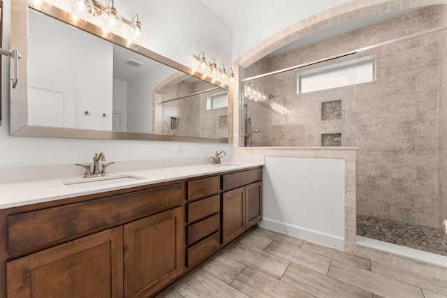 5701 Cherokee Draw Rd, Austin, TX 78738 - bathroom featuring double vanity and walk in shower
