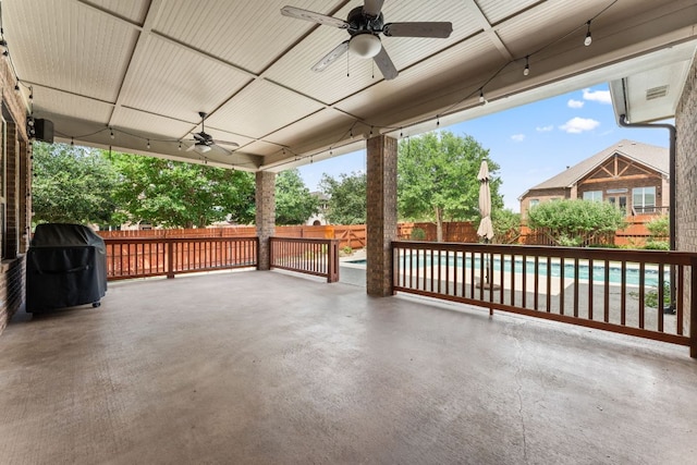 5701 Cherokee Draw Rd, Austin, TX 78738 - fenced backyard featuring a ceiling fan, a patio, and a grill