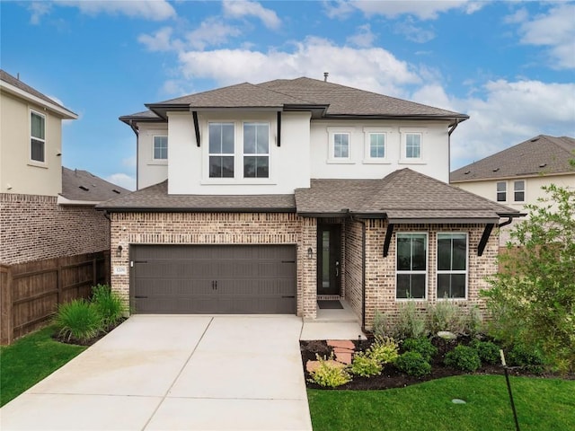 1209 Willie Ranch Way, Leander, TX 78641 - view of front of property with driveway, an attached garage, brick siding, and stucco siding