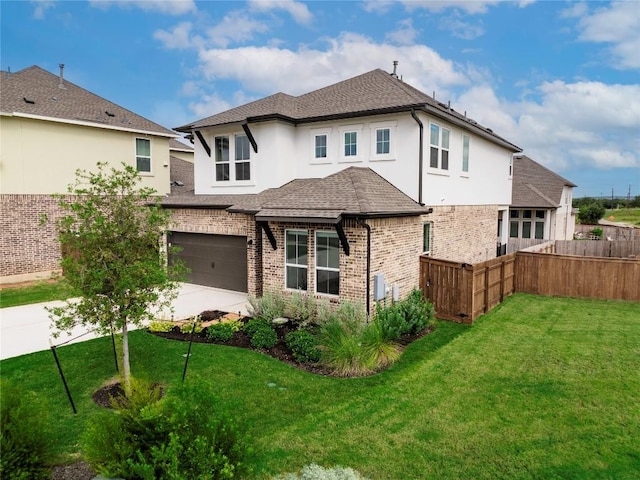 1209 Willie Ranch Way, Leander, TX 78641 - view of front of home with driveway, an attached garage, stucco siding, brick siding, and roof with shingles